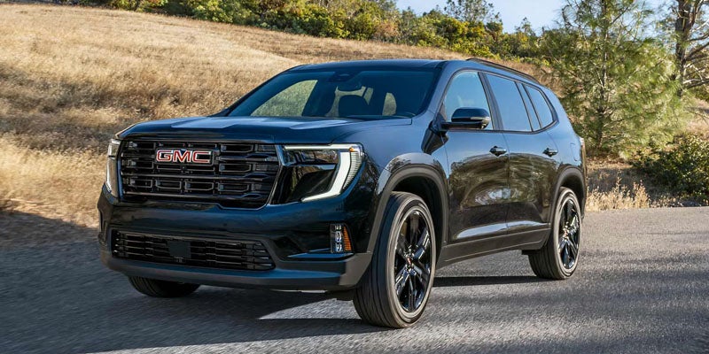 2026 GMC Acadia AT4 black SUV front three-quarter exterior view