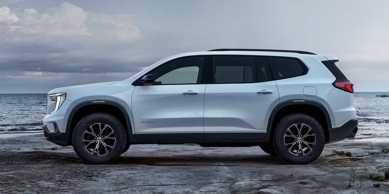 2026 GMC Acadia side profile parked by the waterfront